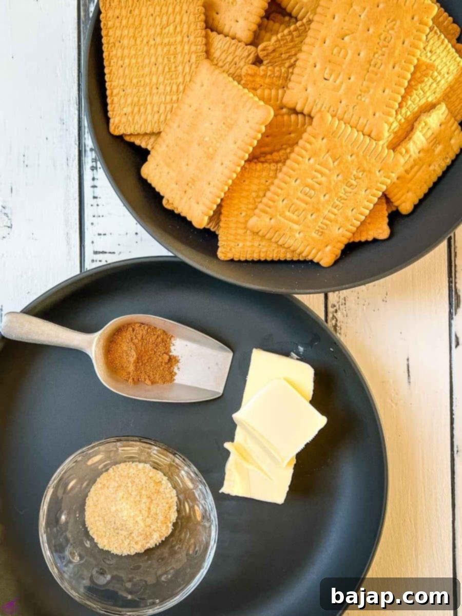 Ingredients for the Christmas cheesecake crust including graham crackers, butter, brown sugar, and spices