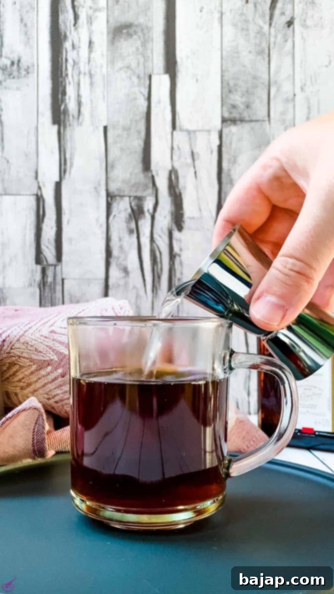 Add the Cointreau to the coffee.