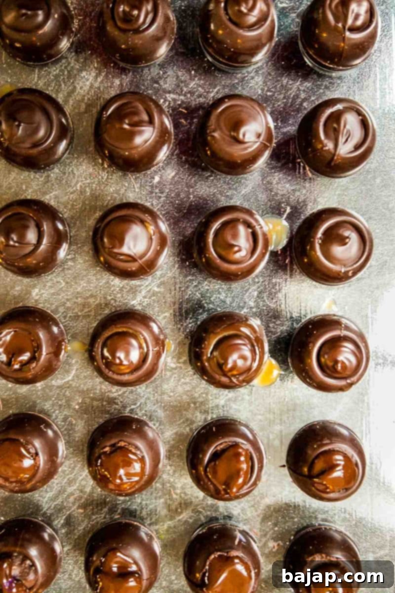 Perfectly sealed salted caramel chocolate truffles, ready for their final coating.