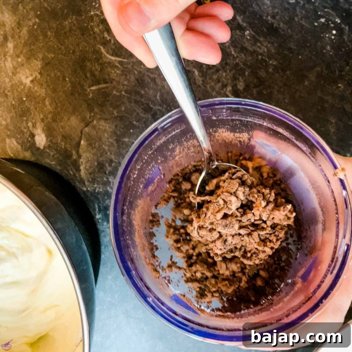 Adding crushed After Eight pieces to the cream cheese filling mixture.