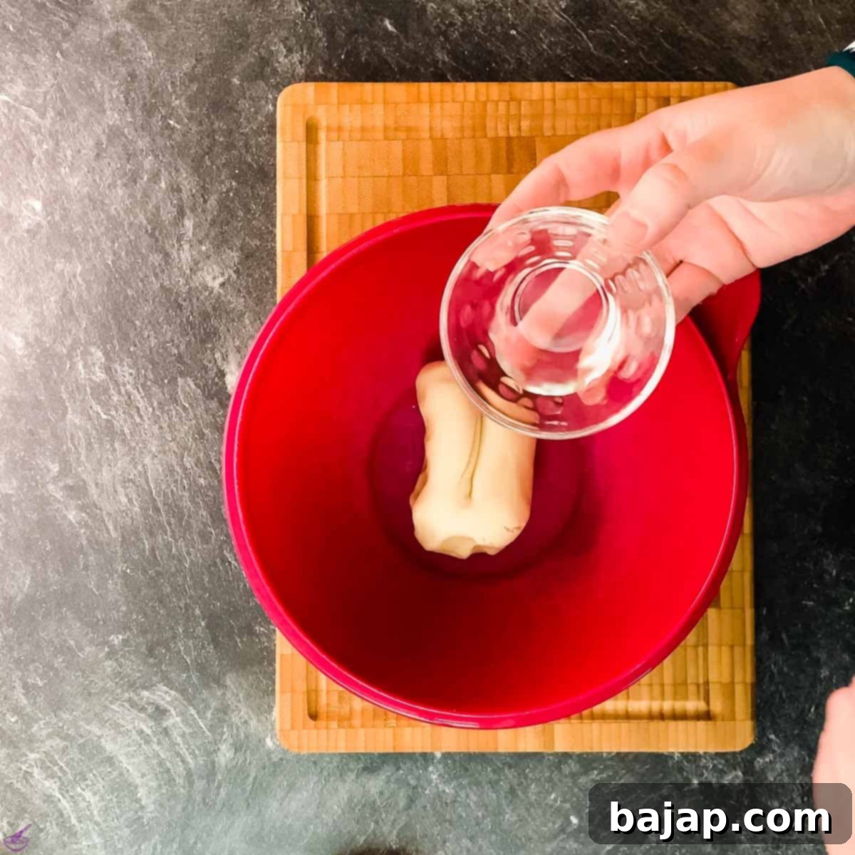 Add rose water to the marzipan.