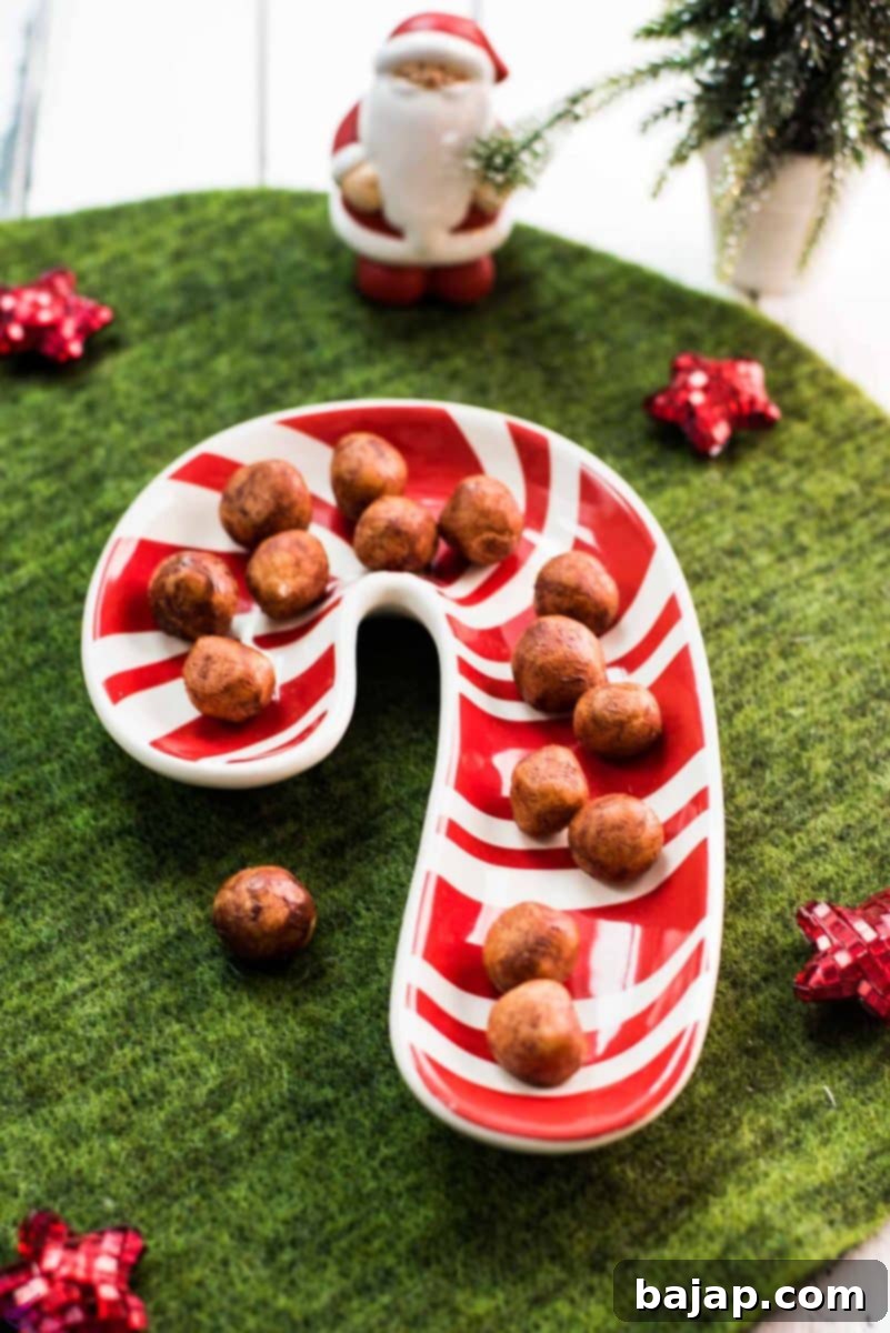 Delicious homemade marzipan candy, also known as marzipan potatoes, infused with orange-flavored liqueur and coated in dark chocolate. Perfect for holidays.
