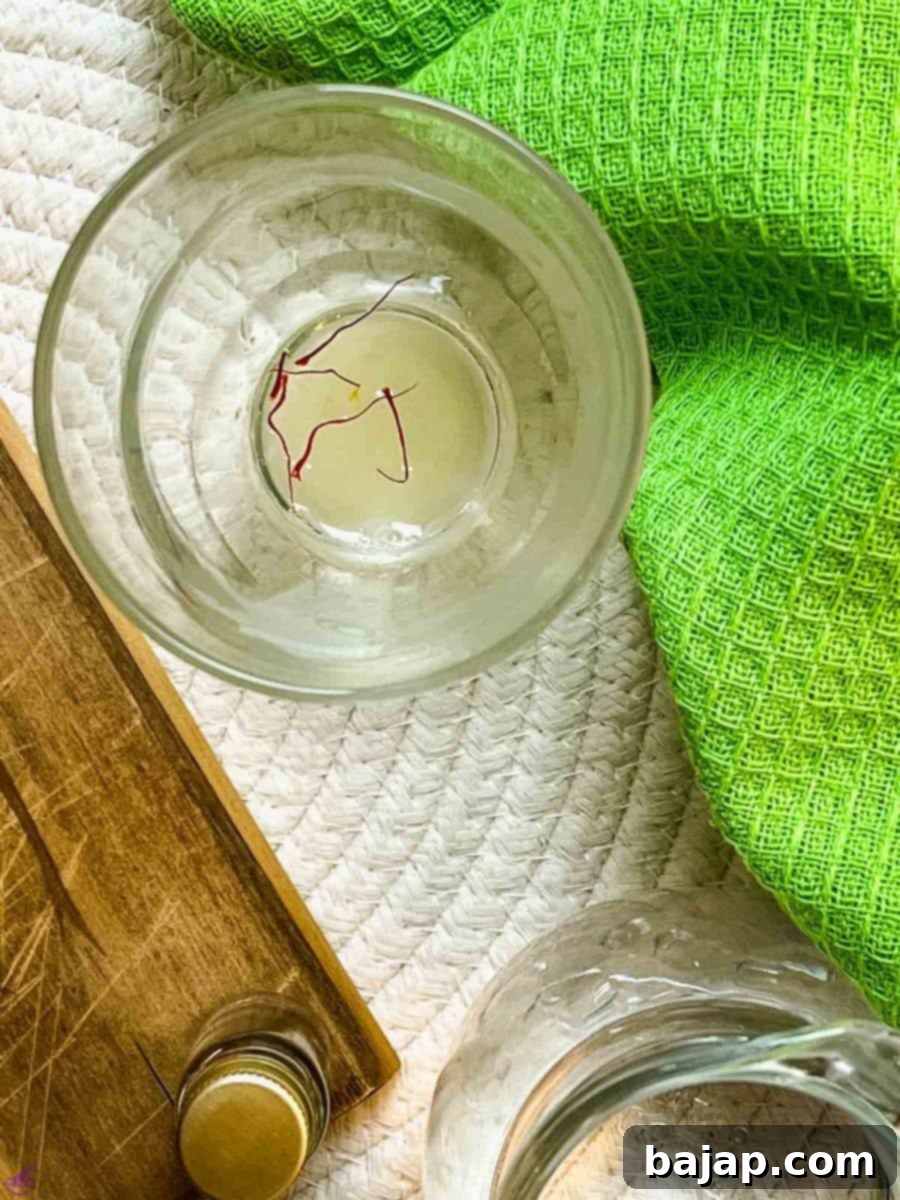 Combine freshly squeezed lemon juice and saffron threads in a glass.