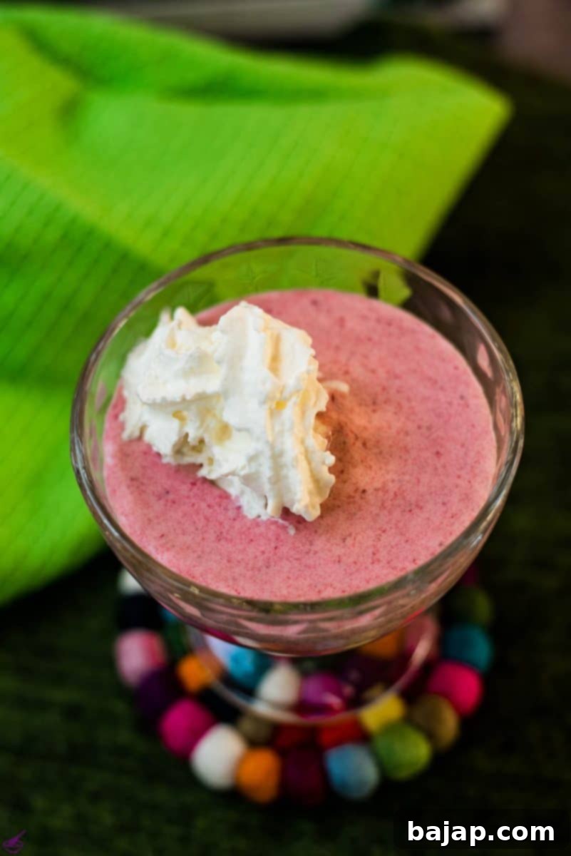Ready to eat strawberry cream with a wonderful intense pink color and creamy texture, garnished with a fresh strawberry. A divine, easy dessert!