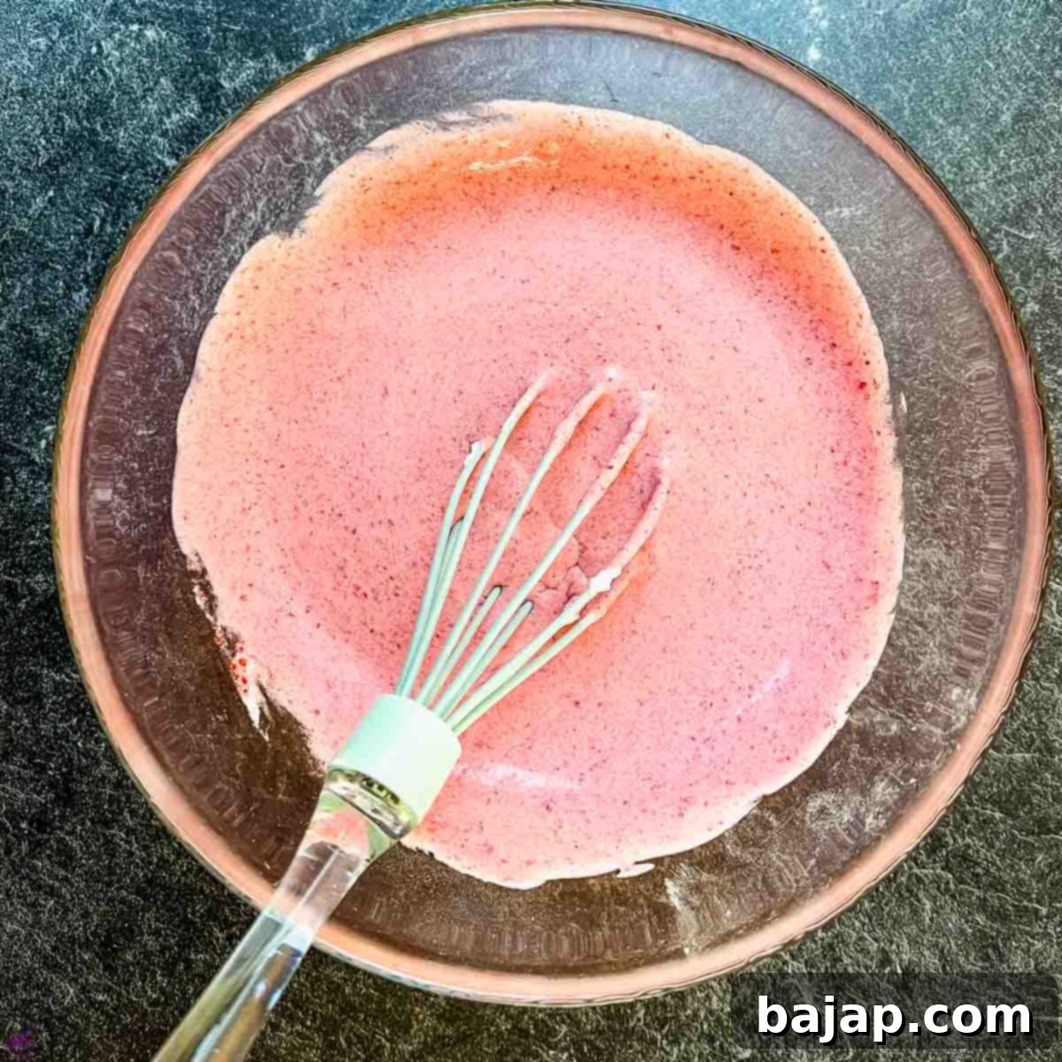 The strawberry purée and whipped cream beautifully combined for a smooth, creamy, and irresistible dessert ready for serving.