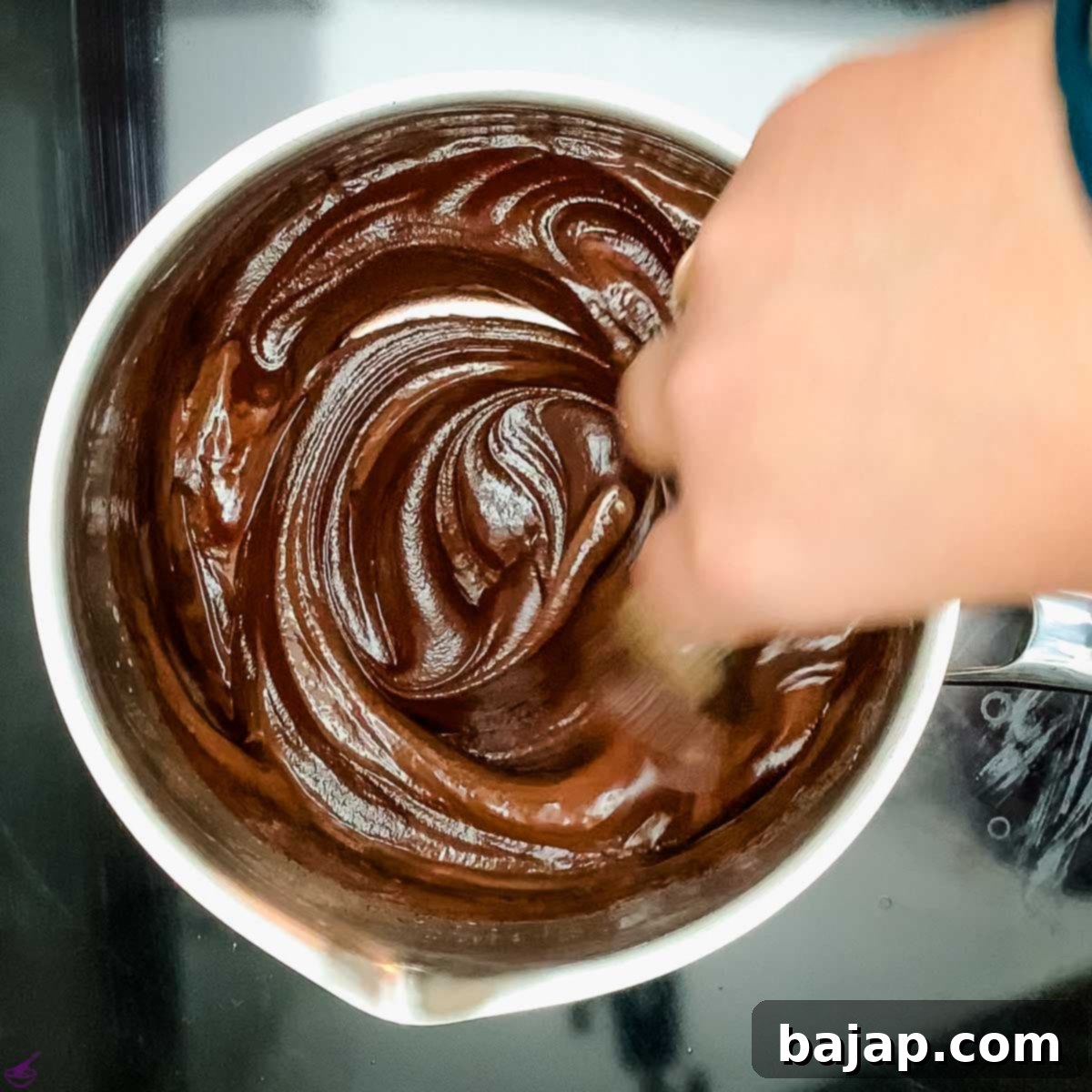 Mix the hot heavy cream with the dark chocolate couverture.