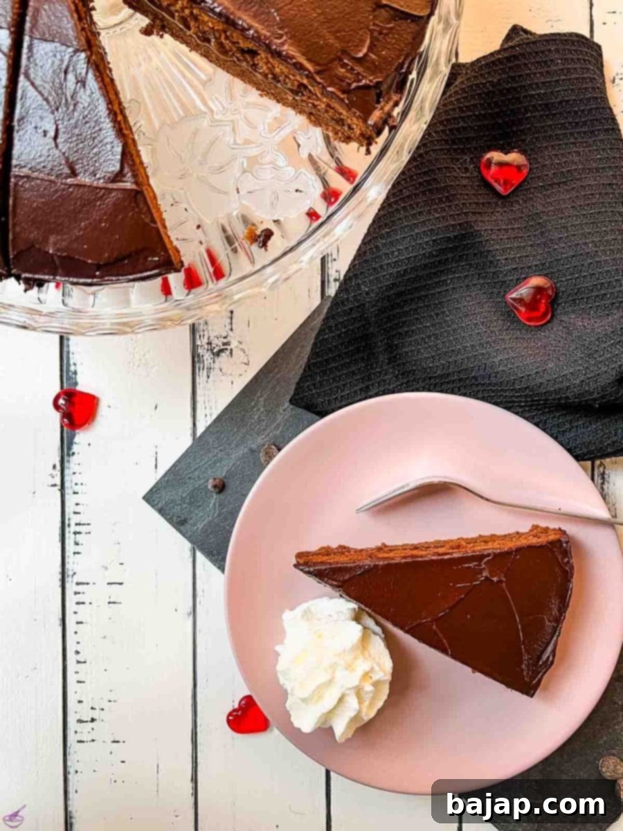 Serve a delicious slice of Sacher cake with a dollop of whipped cream, enhancing its rich chocolate flavor.