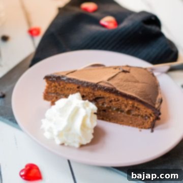 Serve a delicious slice of Sacher cake with a dollop of whipped cream.