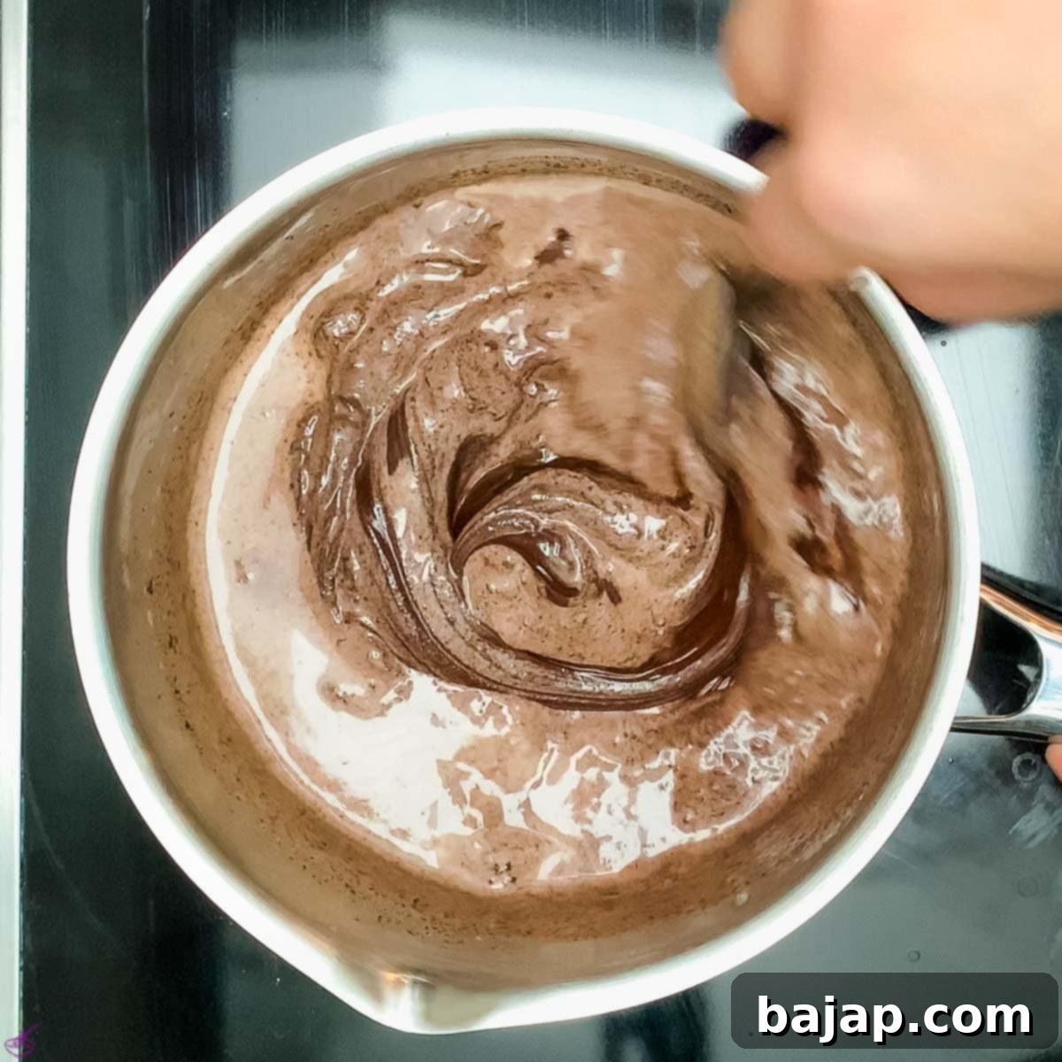 Add the chocolate couverture to the hot heavy cream.