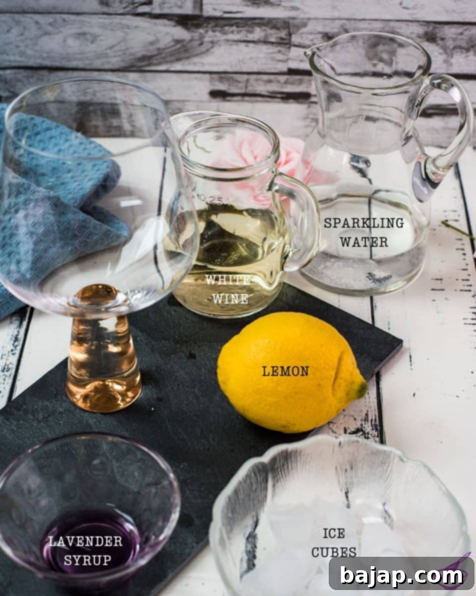 Ingredients laid out for a delicious lavender spritz cocktail, including lemon, ice, sparkling water, white wine, and lavender syrup.