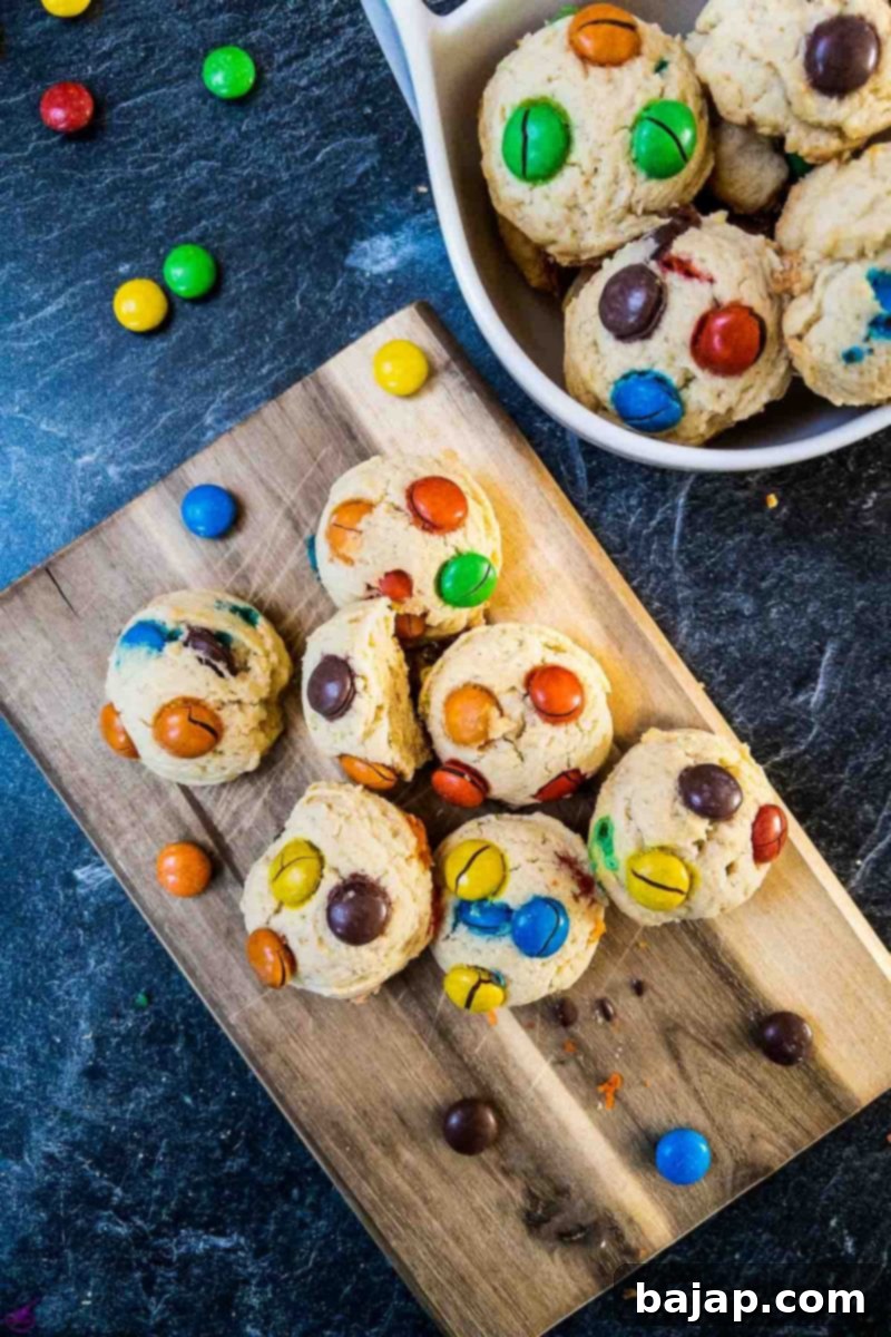 Freshly baked, warm, and ready-to-eat M&M Cookies cooling on a rack, showcasing their vibrant colors and soft texture.