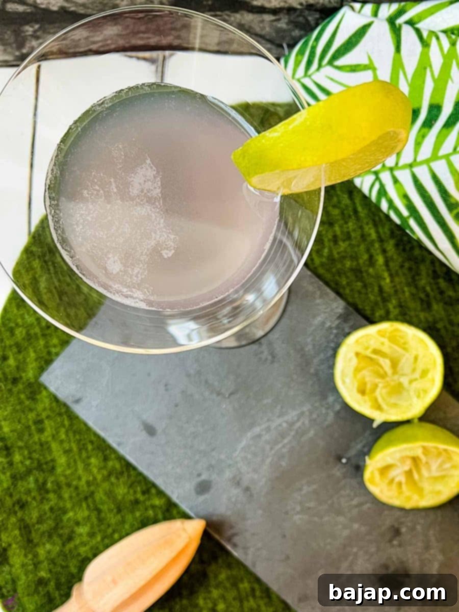 Preparing a lavender daiquiri, showing a cocktail shaker with ingredients, ready to be shaken.