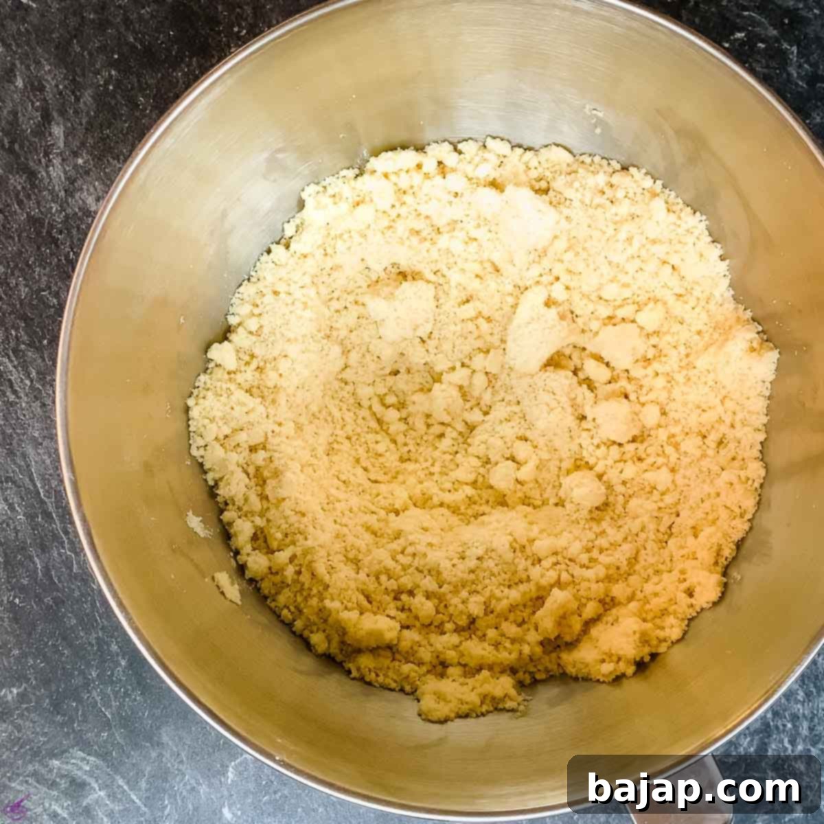 Flour and the butter are fully worked together when they look like breadcrumbs.