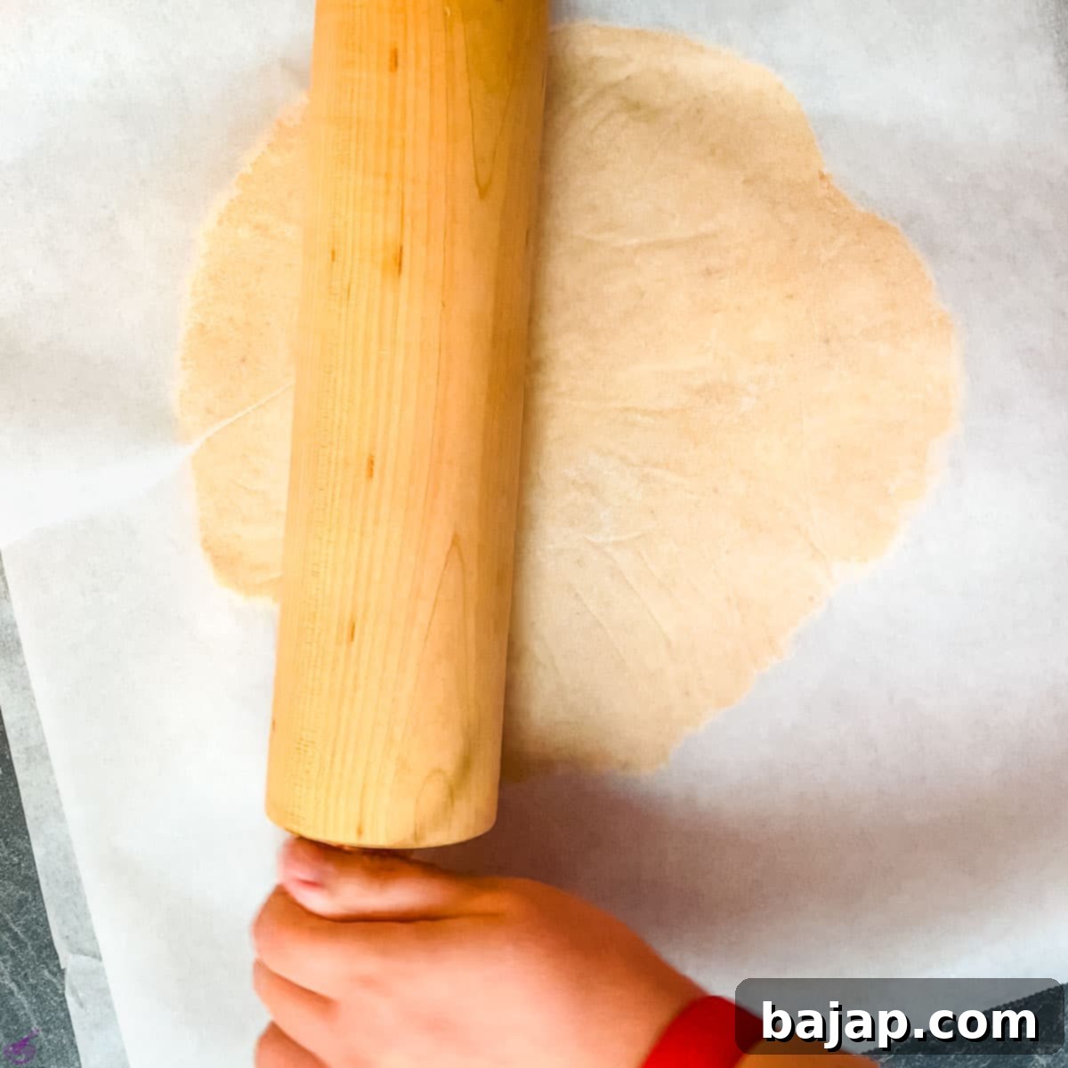 Roll out the dough with a rolling pin.