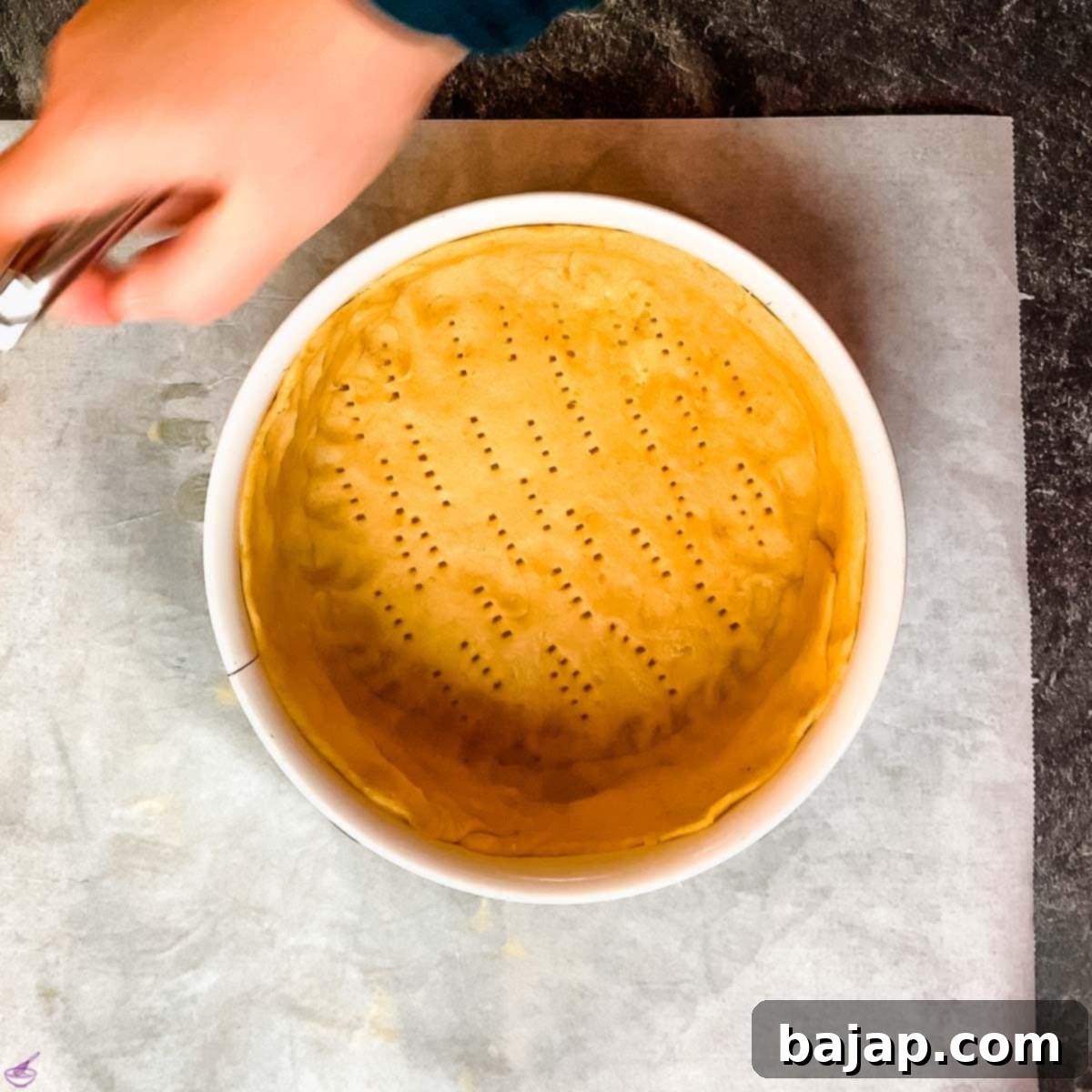 Poke a few holes into the dough using a fork.
