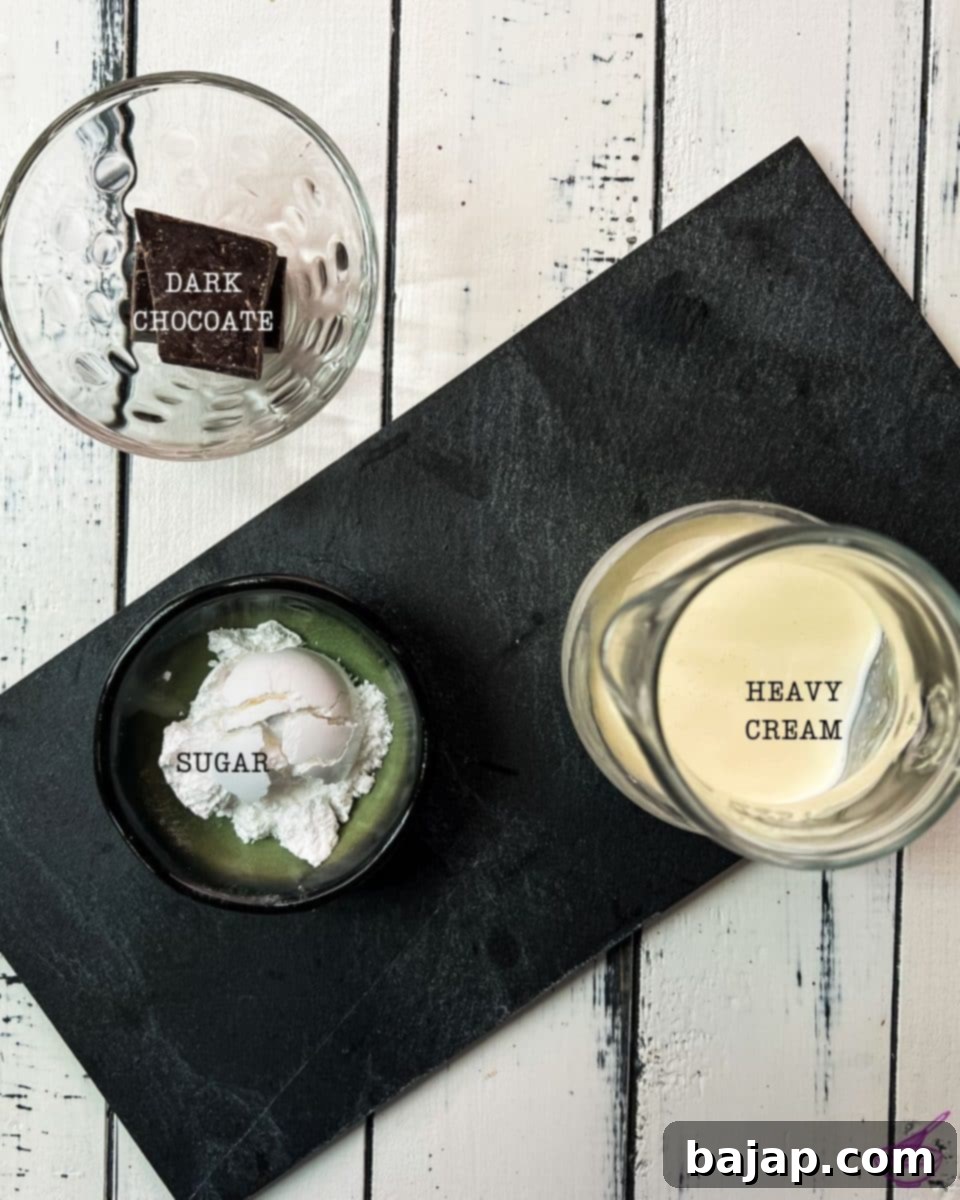 Three core ingredients for making delicious chocolate-flavored whipped cream: heavy whipping cream, powdered sugar, and grated dark chocolate.