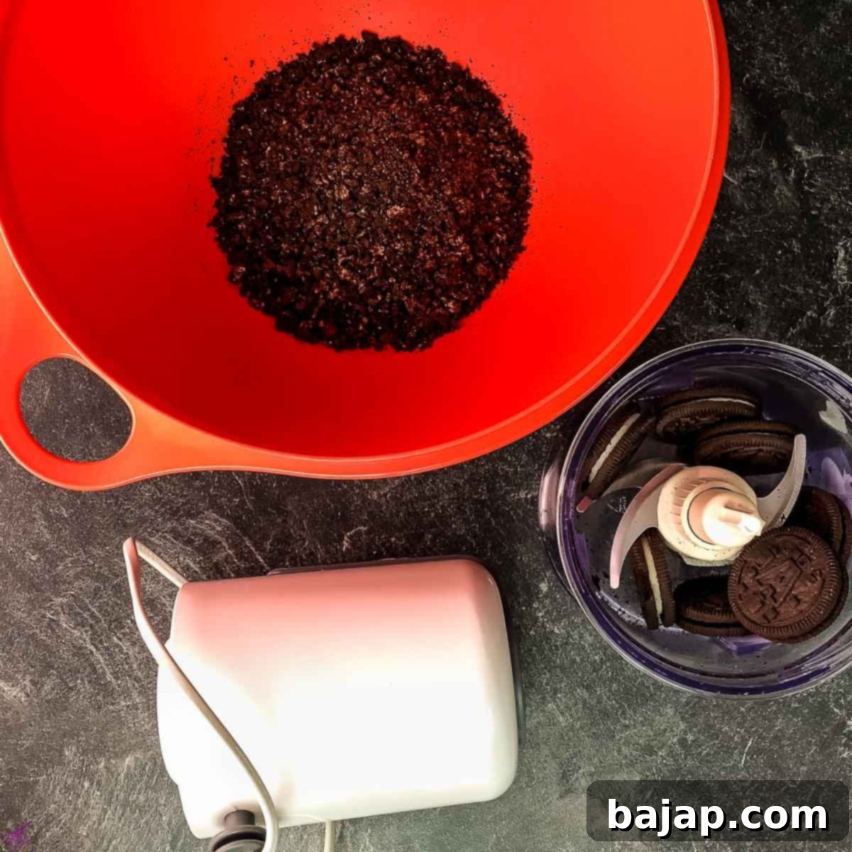 Crush the Oreo cookies and walnuts using an electric chopper for a fine crumb.