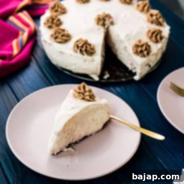 A delicious slice no bake strawberry cheesecake with Oreo walnut crust.