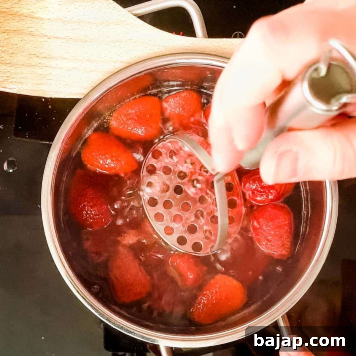 Crush the softened strawberries with a potato masher directly in the saucepan to release more flavor.