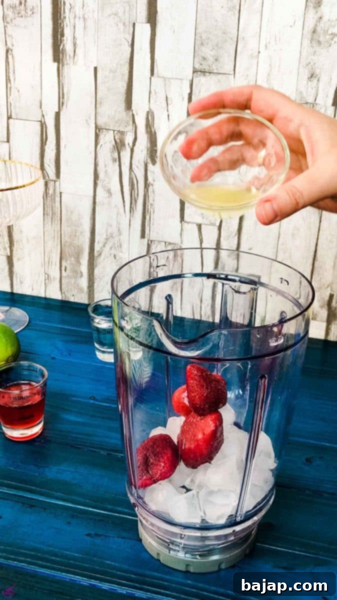 Add the freshly squeezed lime juice to the blenders' container for your frozen strawberry daiquiri.