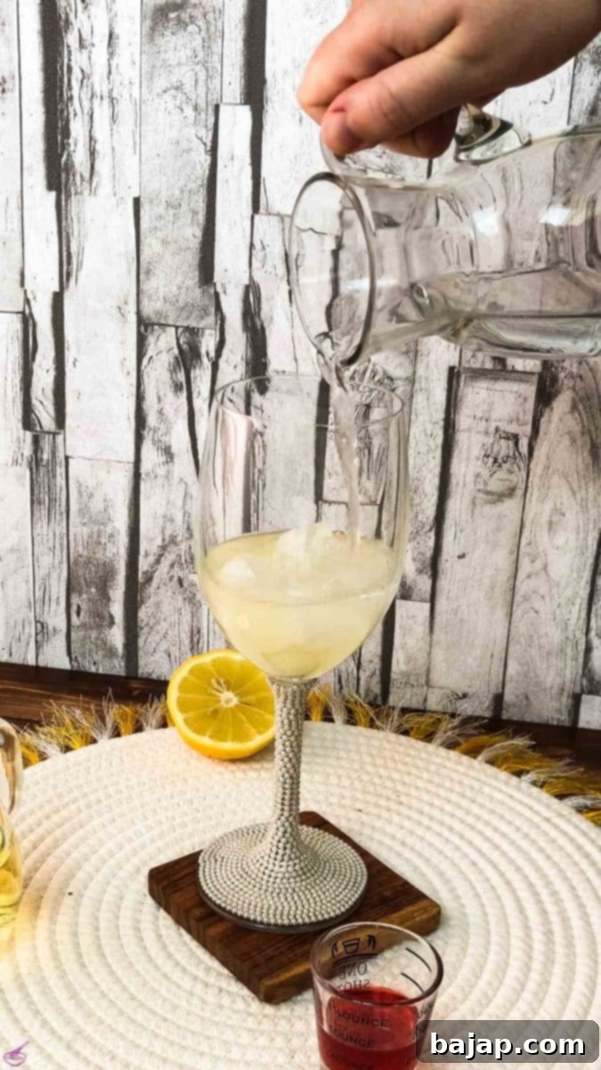 After adding the lemon juice, add the sparkling water.