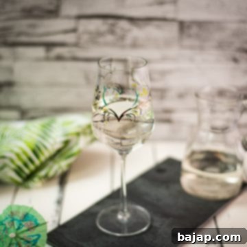 A gorgeous glass filled with a refreshing white wine spritzer! Enjoy!