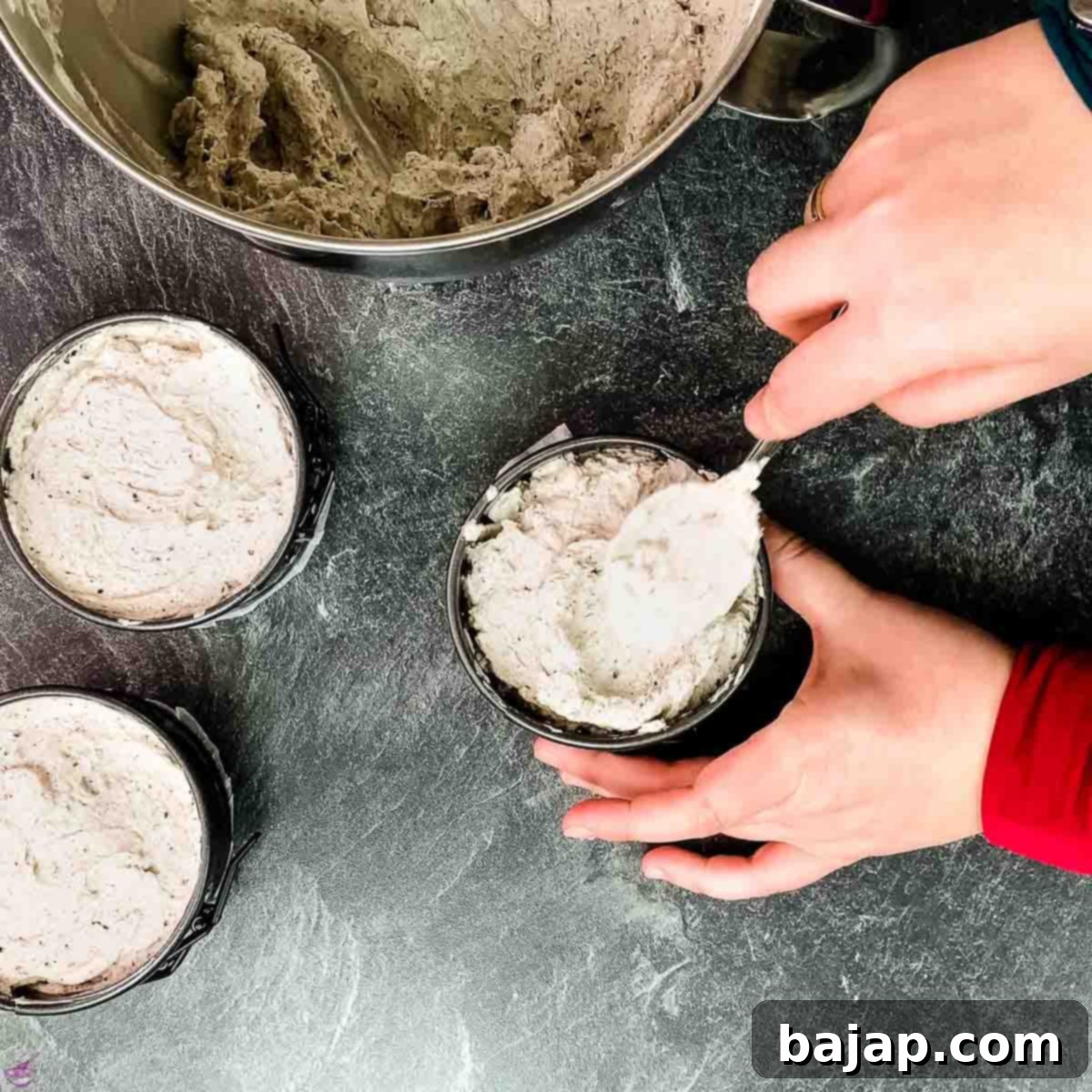 Cover your Oreo crusts with the Oreo and cream cheese mixture.