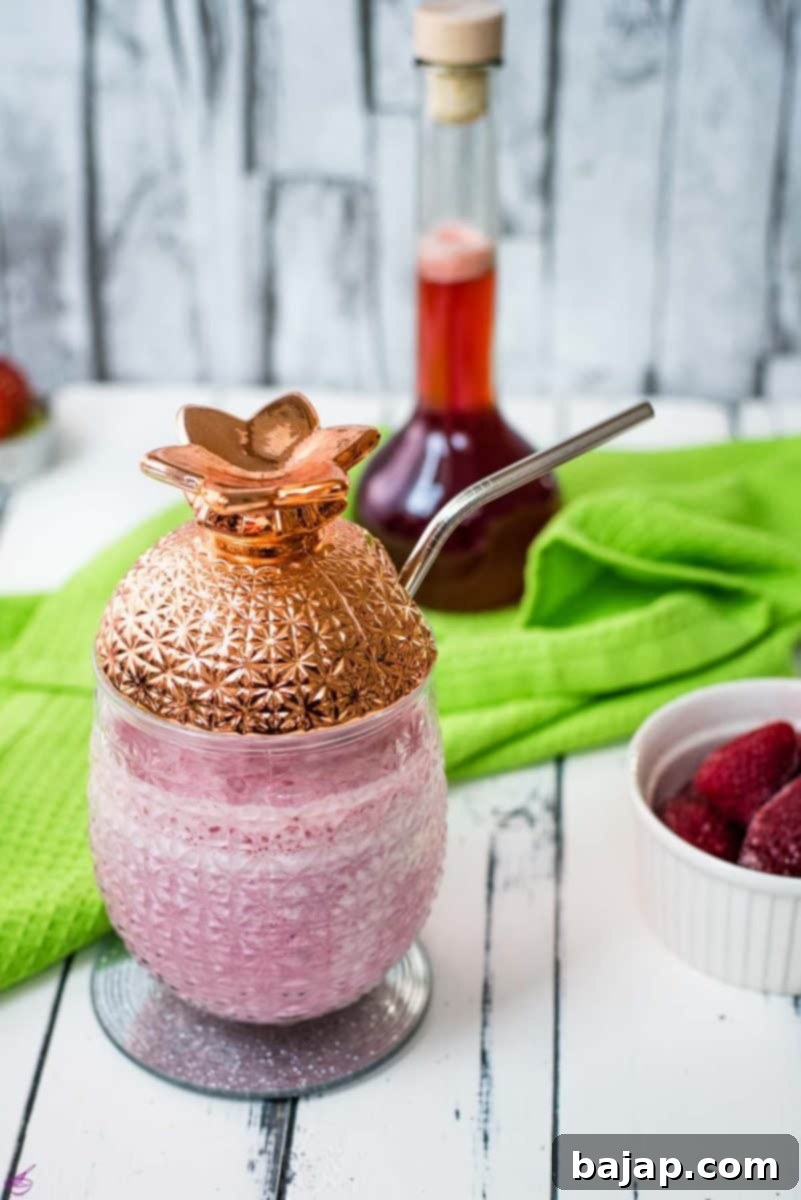 Quick & Creamy Homemade Strawberry Milkshake 2 Delicious creamy strawberry milkshake with only four ingredients in a beautiful pineapple-shaped cocktail glass.