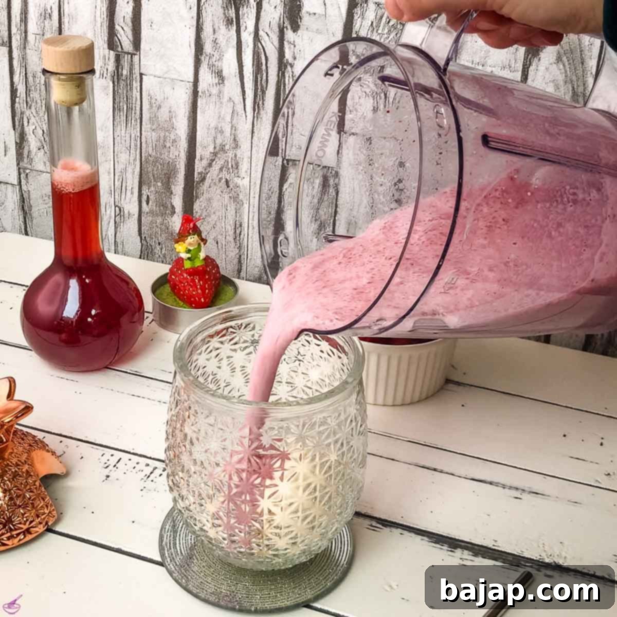 Quick & Creamy Homemade Strawberry Milkshake 5 Pour the strawberry milk and strawberry syrup mixture over the vanilla ice cream in the cocktail glass.