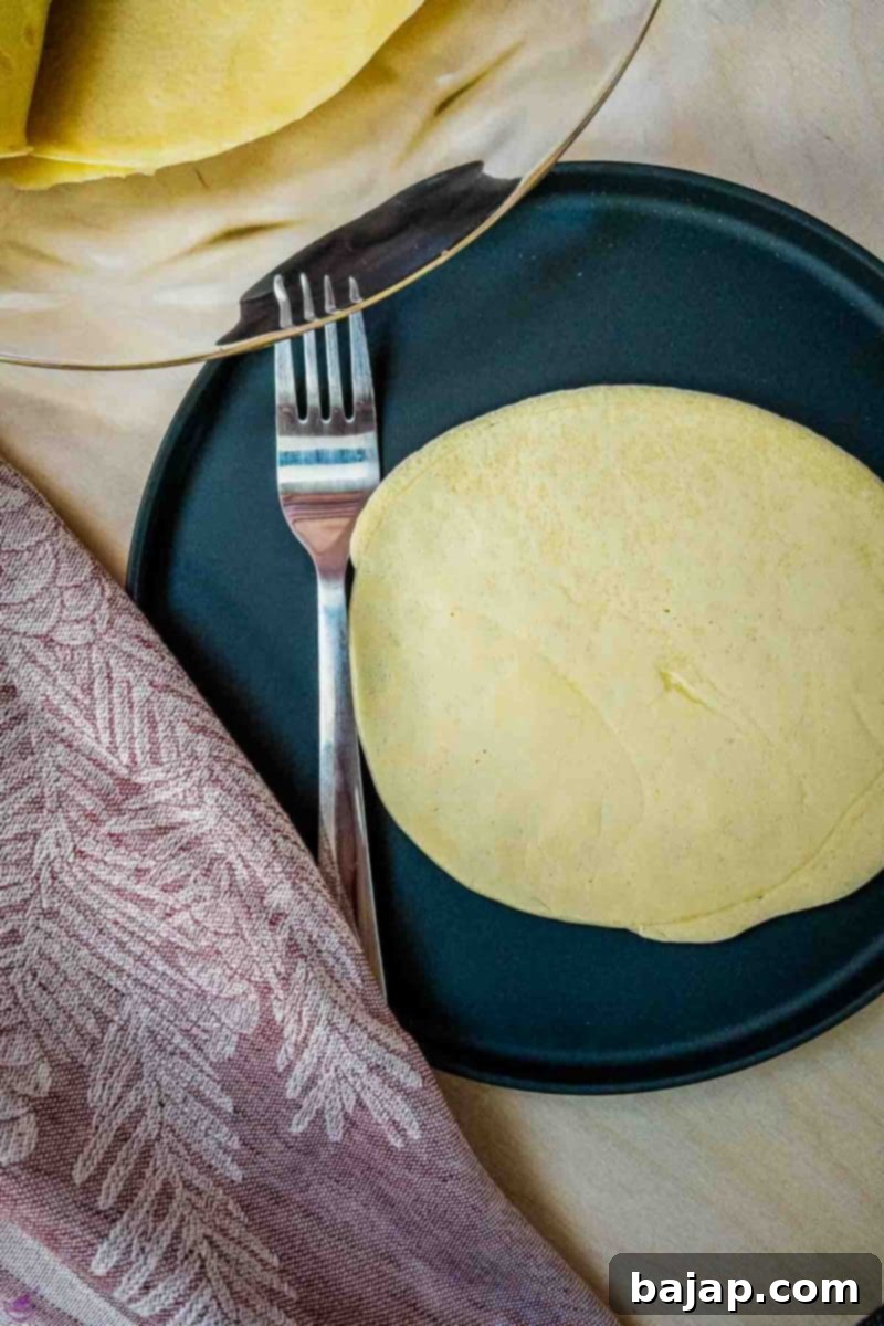 Place the thin pancake on a serving plate.