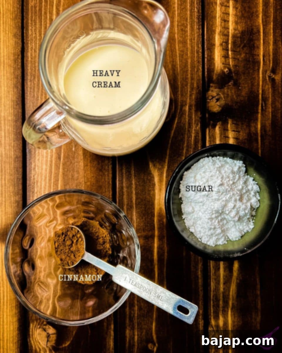Three simple ingredients laid out to make a delicious cinnamon whipped cream: confectioners sugar, heavy whipping cream, and Ceylon cinnamon.