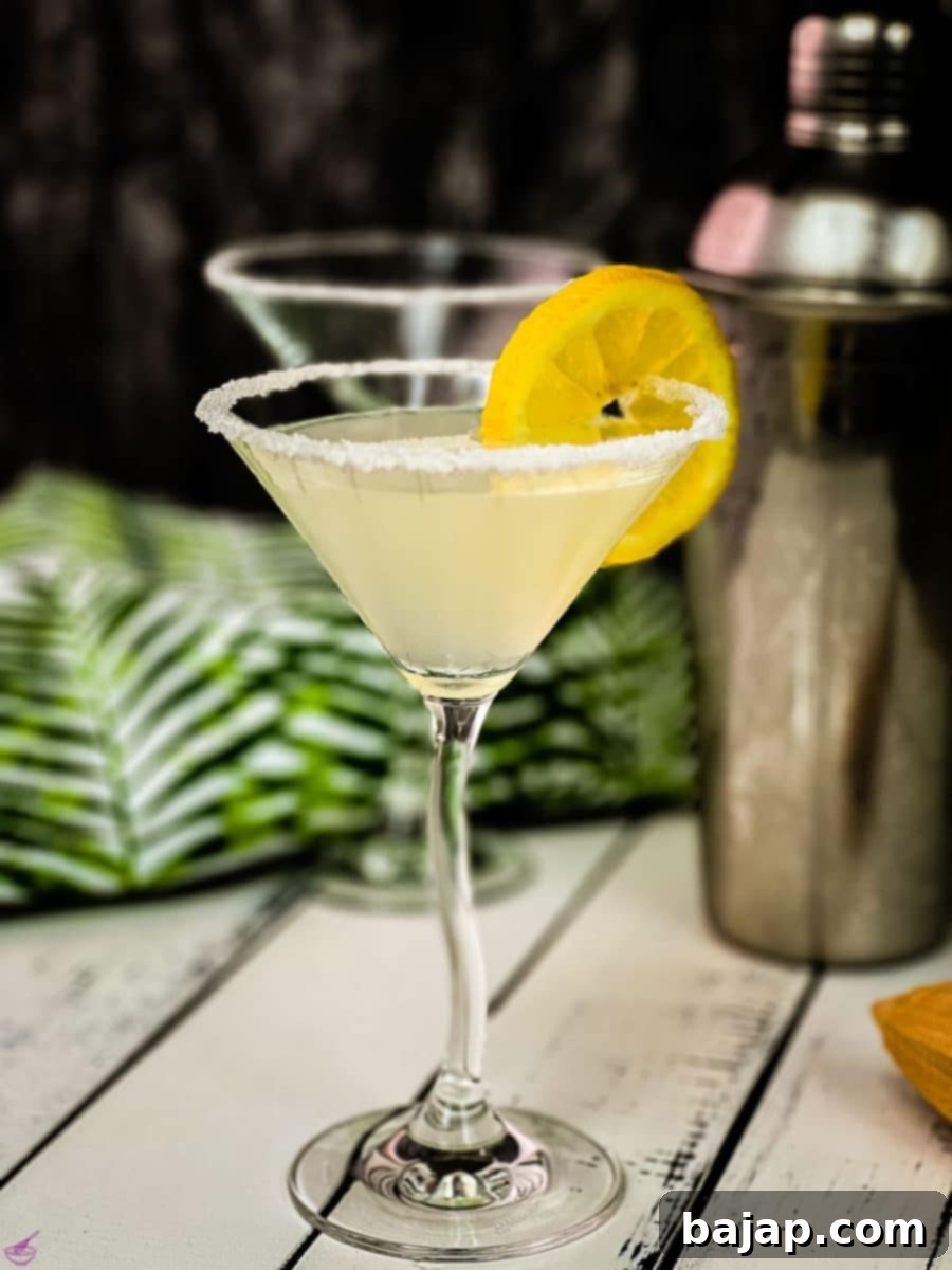 Gorgeous cocktail glass with a sugar rim filled with a delicious vanilla vodka sidecar.