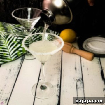Gorgeous cocktail glass with a sugar rim filled with a delicious vanilla vodka sidecar.