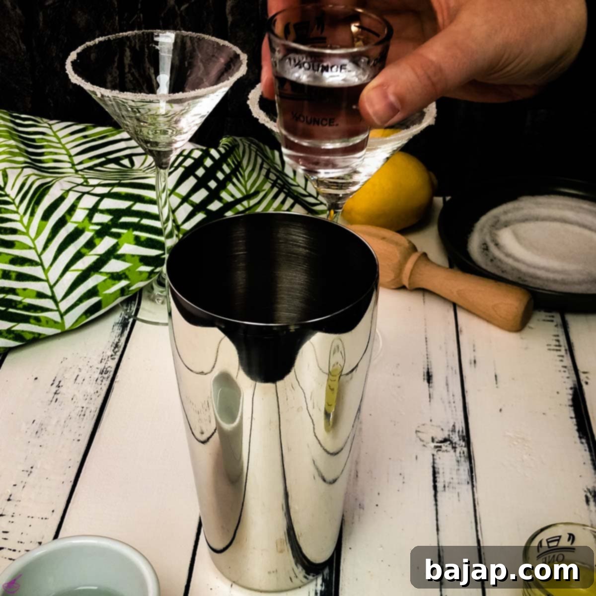 Pour the vanilla vodka into the cocktail shaker with ice.