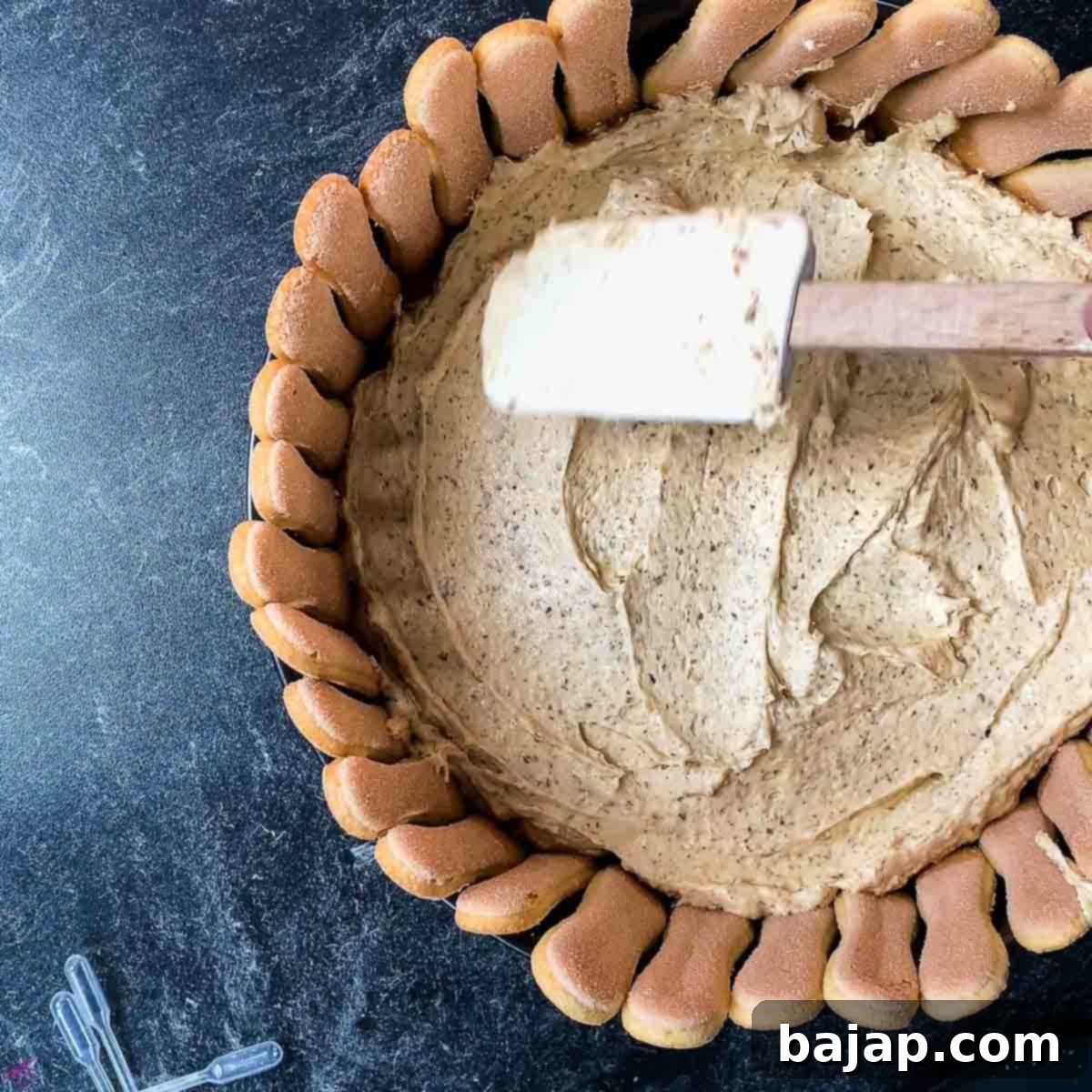 Spread a layer of Almond Creme on the dipped ladyfingers.
