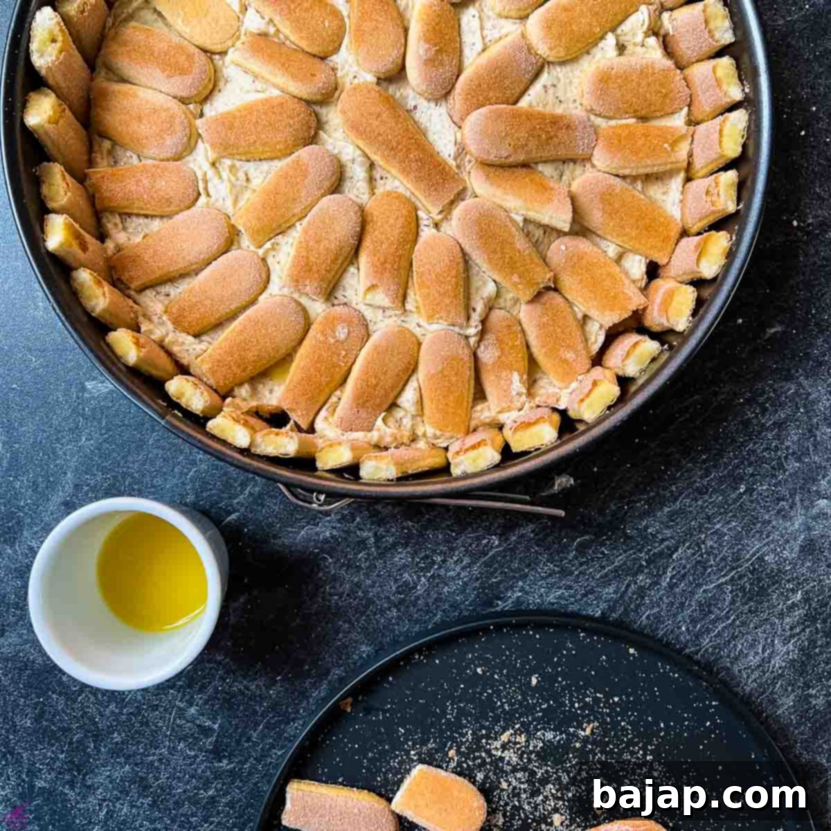 Drizzled ladyfingers with orange juice.