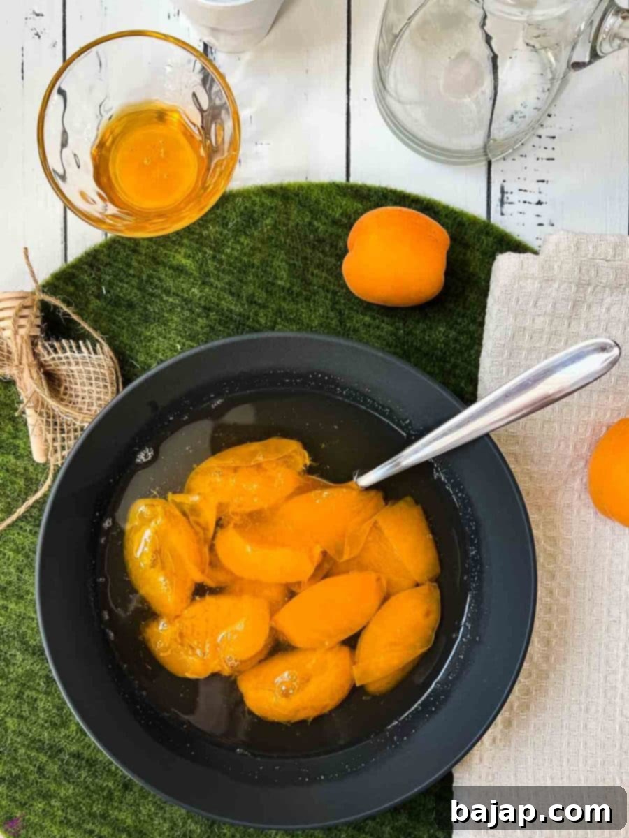 Black bowl filled with a healthy and delicious apricot compote.