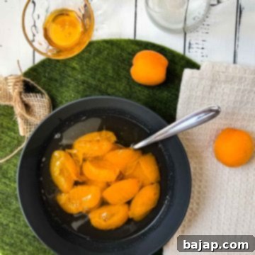 Black bowl filled with a healthy and delicious apricot compote.