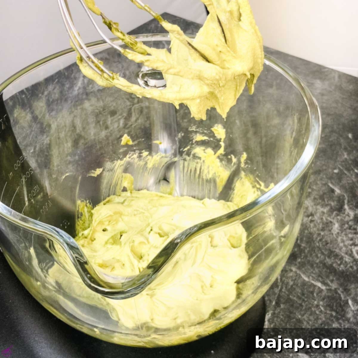 Whip the Matcha butter until creamy and light with granulated sugar.