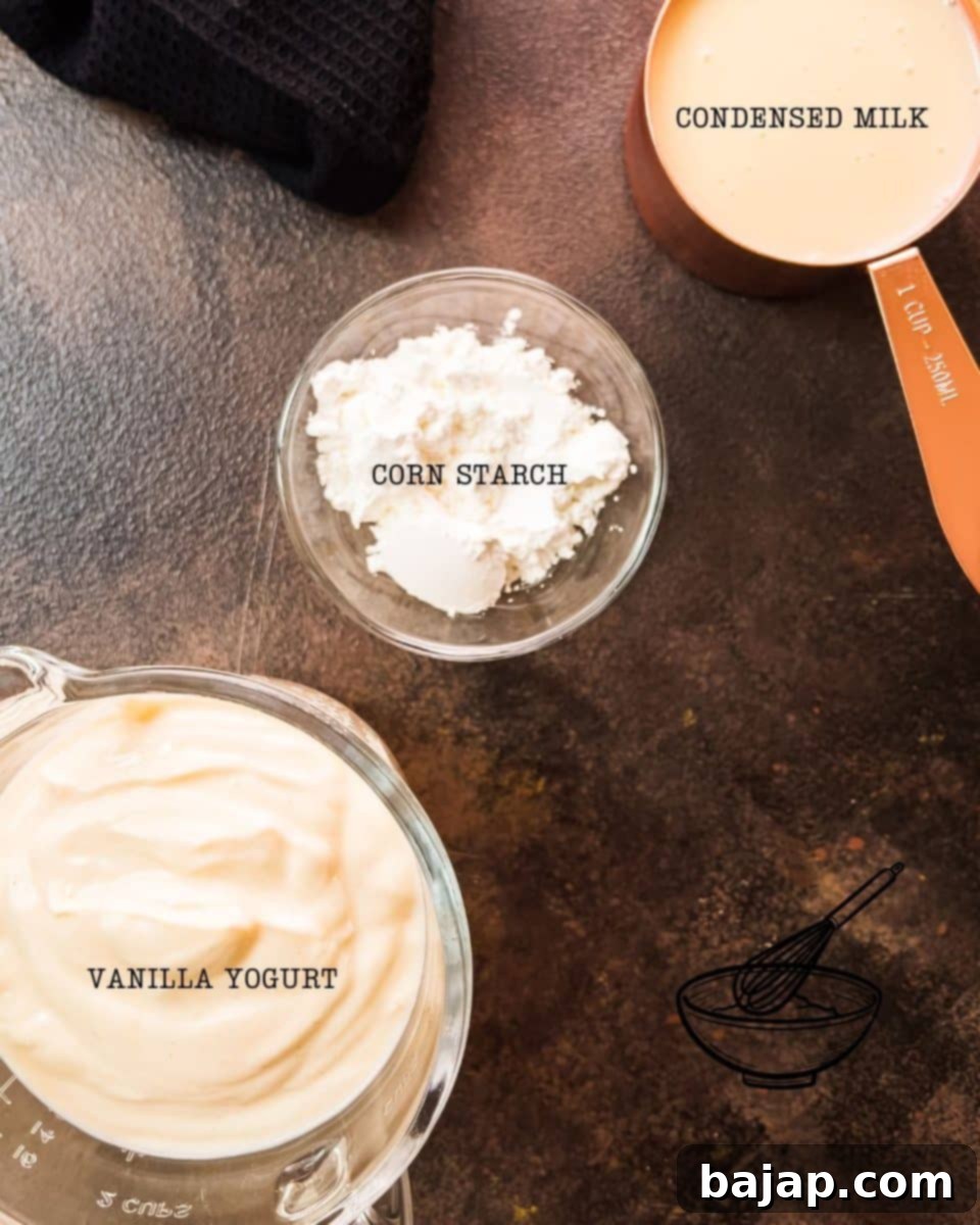 Ingredients for three ingredient vanilla yogurt cake - Corn starch, condensed milk, and vanilla yogurt, laid out on a rustic wooden surface.