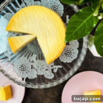Three ingredient yogurt cake on gorgeous glass cake plate, ready for serving.