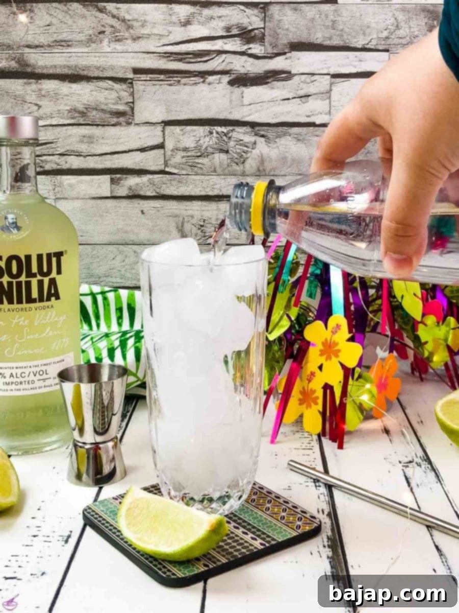Top the glass off with tonic.