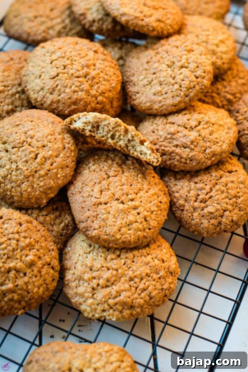 Oatmeal cinnamon cookies placed on cooling rack.