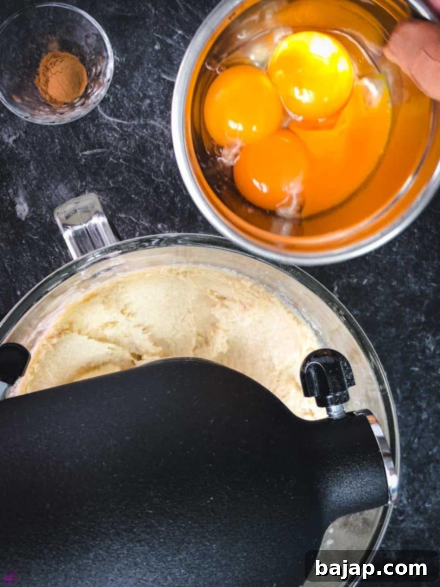 Taste Autumn's Warmth: Unbelievably Soft Pumpkin Cookies 6 Add the egg yolks one by one to the butter and sugar mixture.