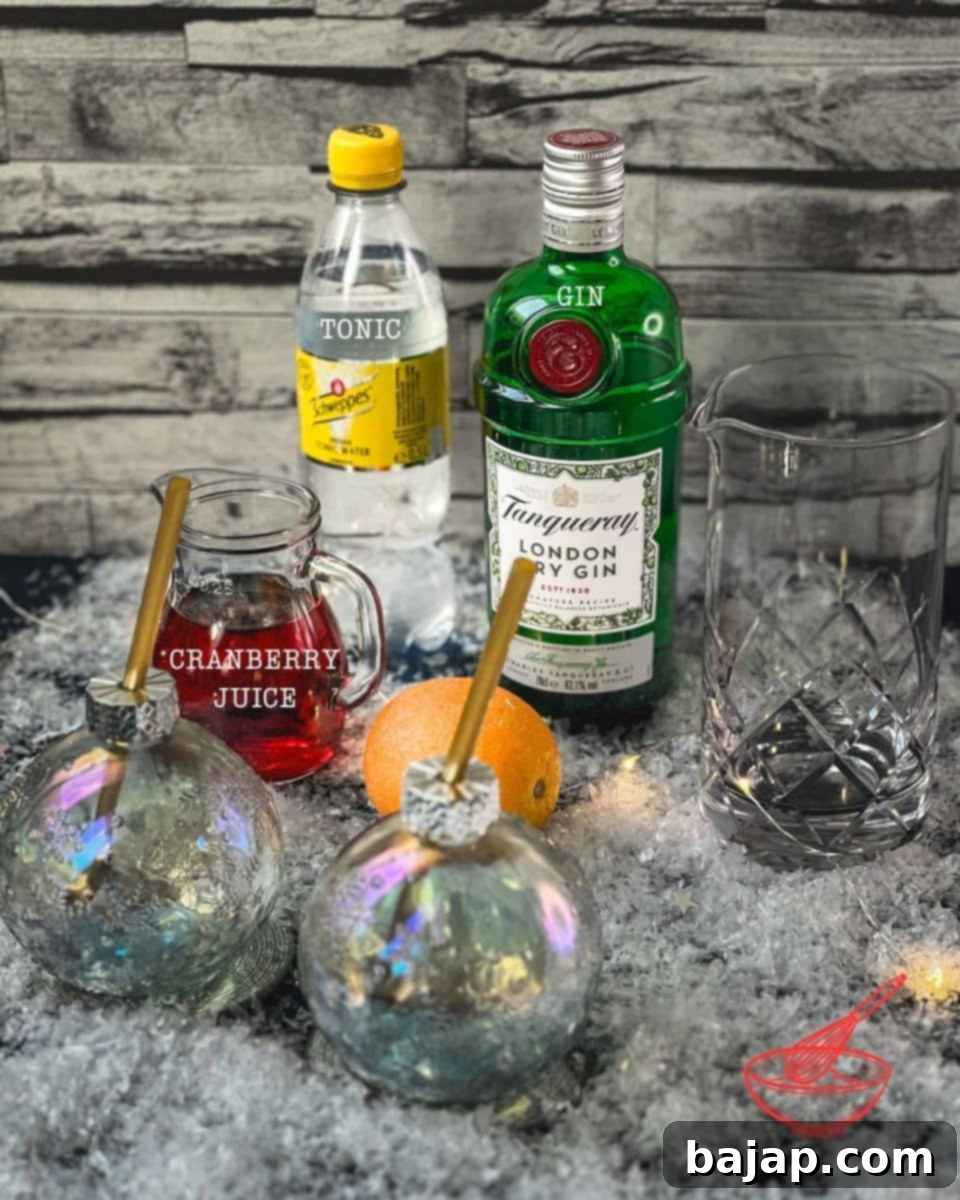 Three key ingredients for a cranberry gin cocktail: gin, cranberry juice, and tonic water.
