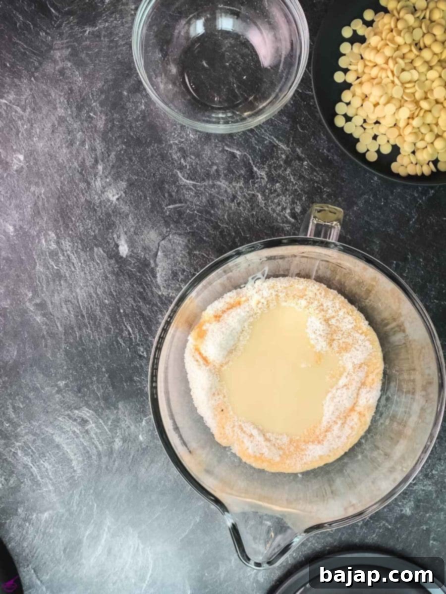 Add the eggnog to the shredded coconut.