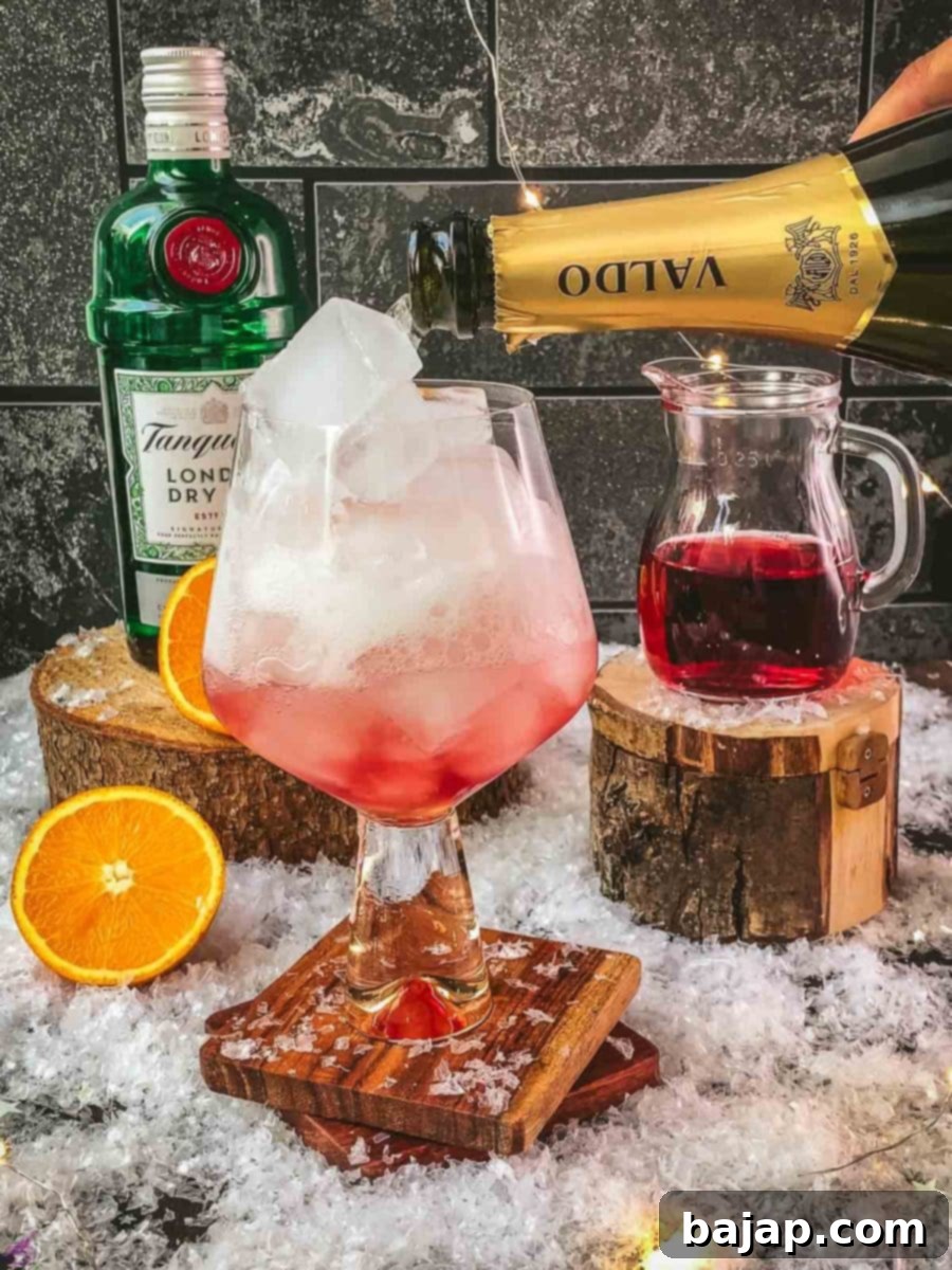 Top the cranberry gin with prosecco.