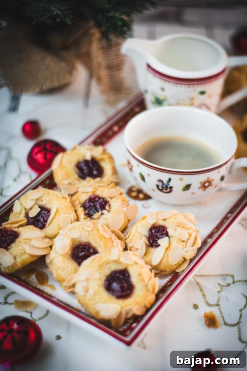 Delectable raspberry almond thumbprint cookies, also known as Husaren Krapferl, beautifully arranged on a festive Christmassy plate, accompanied by a steaming cup of coffee, evoking a sense of warm holiday comfort.