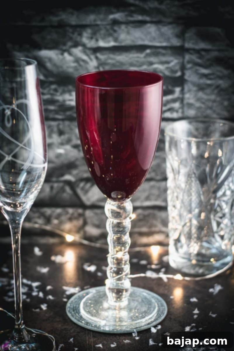 Mastering Tall Glassware: Elevate Every Sip 2 A variety of gorgeous wine, sparkling wine, and collins glasses placed in dark room.