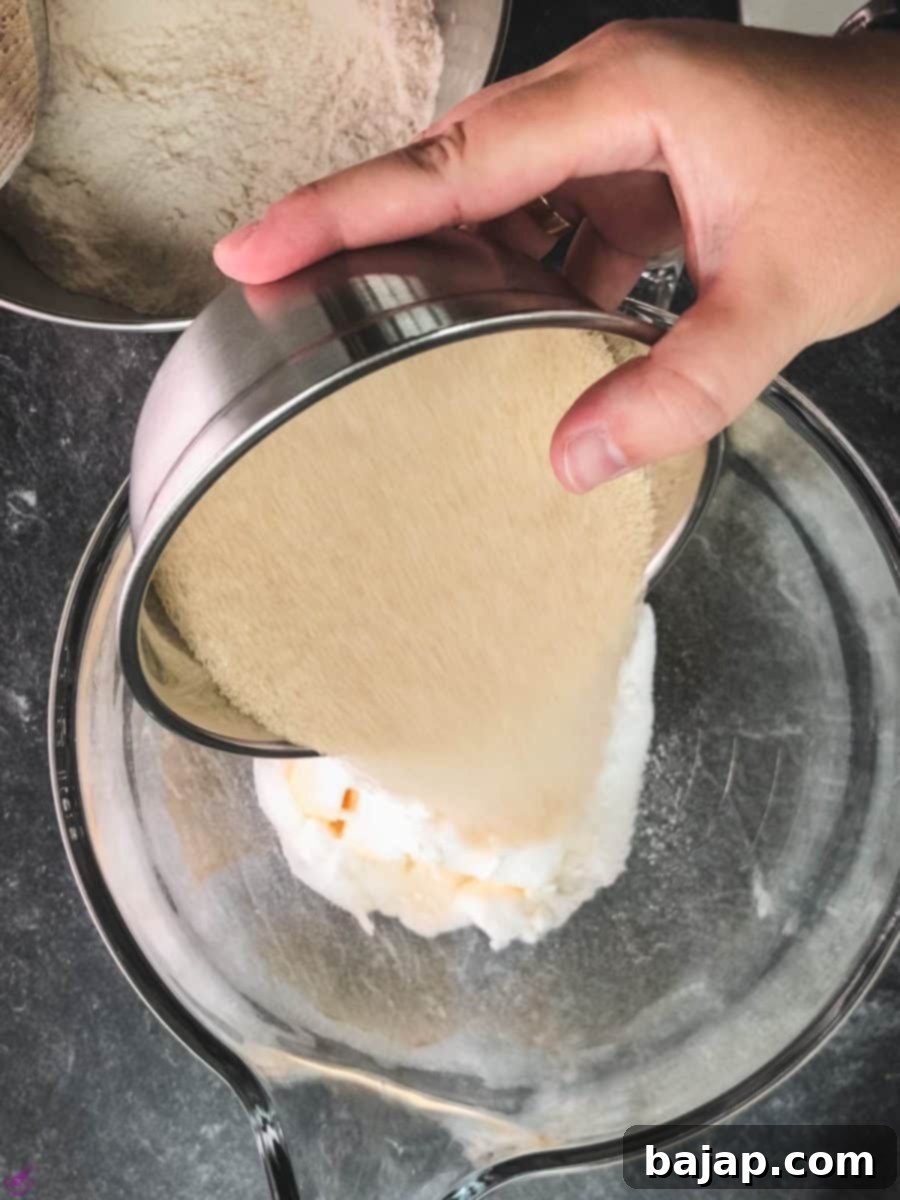 Creaming butter, brown sugar, and granulated white sugar together in a separate mixing bowl until light and fluffy.
